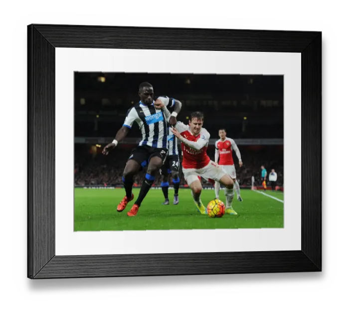 Framed Print : Monreal vs Sissoko: A Premier League Battle at Emirates Stadium (2015-16)
