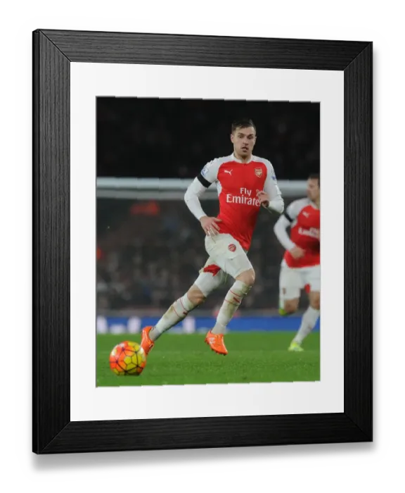 Framed Print : Arsenal's Aaron Ramsey Battles for Possession against Newcastle United in Premier League Showdown (2015-16) Framed Print : Arsenal's Aaron Ramsey Battles for Possession against Newcastle United in Premier League Showdown (2015-16)