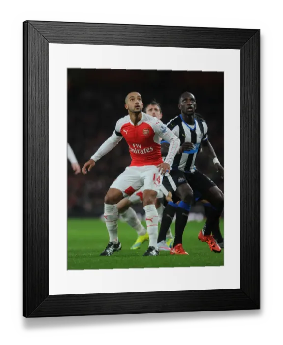 Framed Print : Theo Walcott vs. Moussa Sissoko: A Premier League Showdown at Arsenal vs. Newcastle United