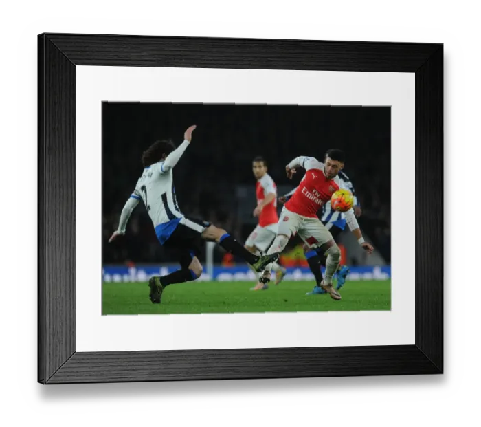 Framed Print : Oxlade-Chamberlain vs. Coloccini: A Football Rivalry at the Emirates Stadium Framed Print : Oxlade-Chamberlain vs. Coloccini: A Football Rivalry at the Emirates Stadium