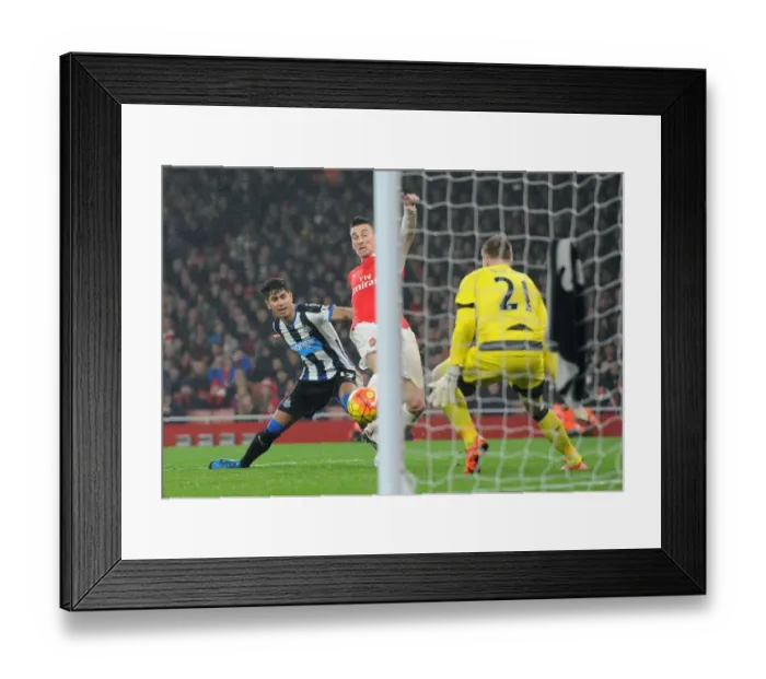 Framed Print : Last-Minute Drama: Koscielny Scores Thrilling Win for Arsenal Against Newcastle United