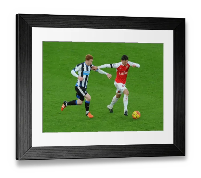 Framed Print : Mesut Ozil vs Jack Colback: A Fierce On-Pitch Battle at Arsenal's Emirates Stadium (Arsenal v Newcastle United, 2015-16) Framed Print : Mesut Ozil vs Jack Colback: A Fierce On-Pitch Battle at Arsenal's Emirates Stadium (Arsenal v Newcastle United, 2015-16)