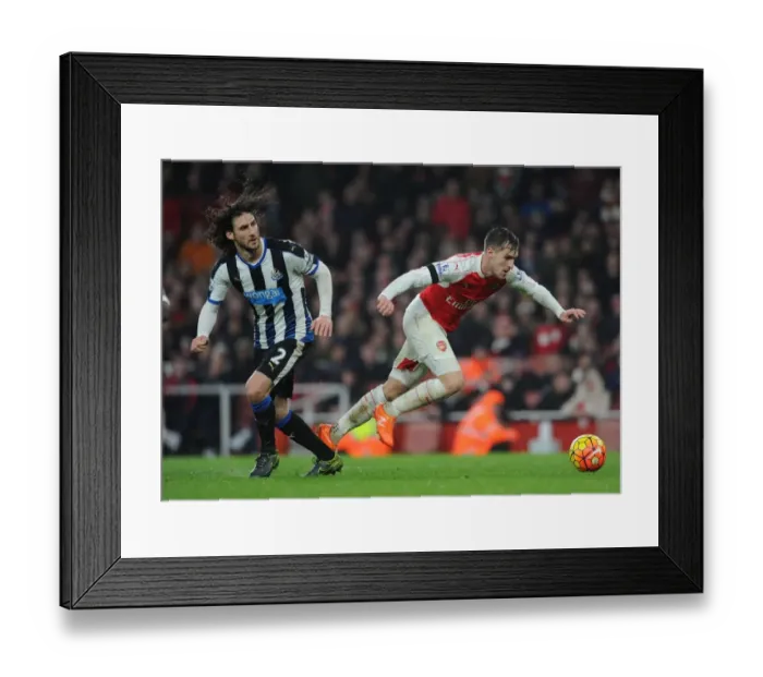 Framed Print : Clash of the Titans: Ramsey vs. Coloccini in Intense Arsenal-Newcastle Showdown Framed Print : Clash of the Titans: Ramsey vs. Coloccini in Intense Arsenal-Newcastle Showdown