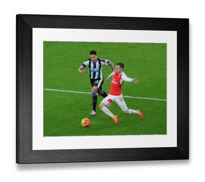 Framed Print : Clash of Midfield Titans: Ramsey vs Mitrovic in Arsenal vs Newcastle Showdown Framed Print : Clash of Midfield Titans: Ramsey vs Mitrovic in Arsenal vs Newcastle Showdown