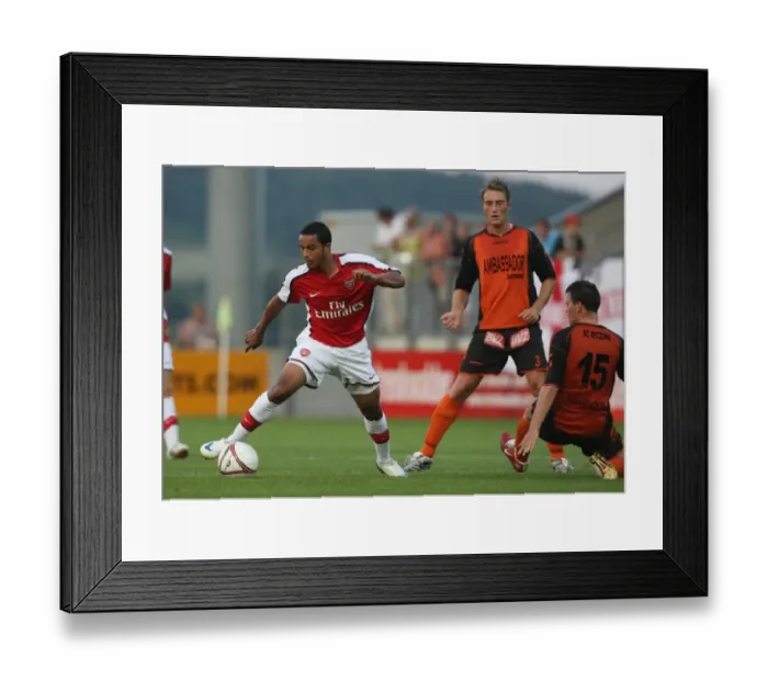 Framed Print : Theo Walcott in Action: Arsenal's Star Forward vs Burgenland, Austria 2008 Framed Print : Theo Walcott in Action: Arsenal's Star Forward vs Burgenland, Austria 2008