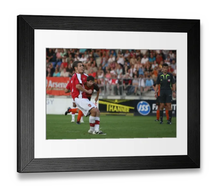 Framed Print : Jack Wilshere shoots past Burgenland goalkeeper Johannes Framed Print : Jack Wilshere shoots past Burgenland goalkeeper Johannes