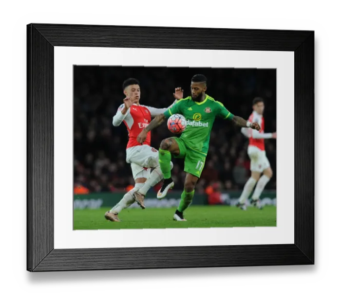 Framed Print : Oxlade-Chamberlain vs Lens: Arsenal's FA Cup Battle at The Emirates