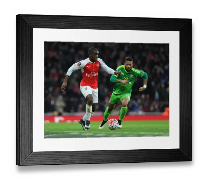 Framed Print : Arsenal's Joel Campbell Outsmarts Sunderland's Jermain Lens in FA Cup Showdown Framed Print : Arsenal's Joel Campbell Outsmarts Sunderland's Jermain Lens in FA Cup Showdown