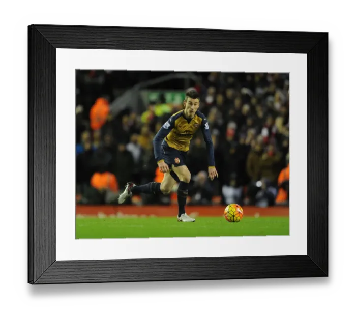 Framed Print : Arsenal's Koscielny Faces Off Against Liverpool at Anfield Stadium (2015-16) Framed Print : Arsenal's Koscielny Faces Off Against Liverpool at Anfield Stadium (2015-16)
