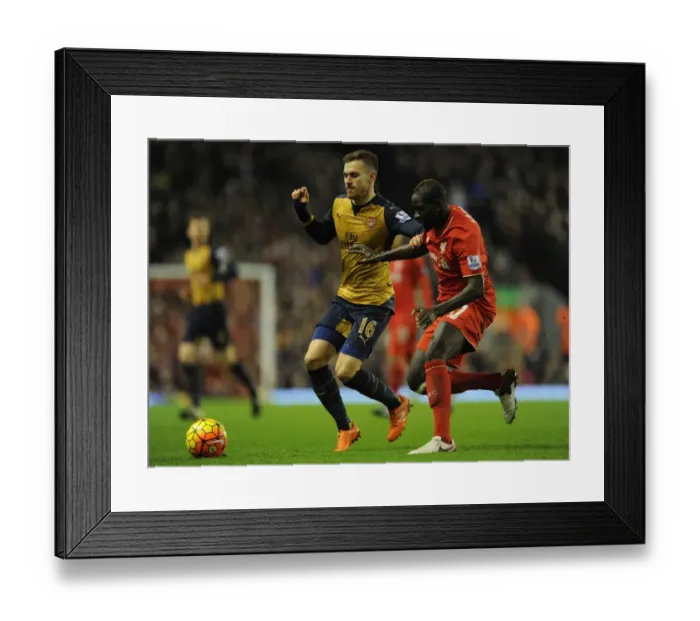 Framed Print : Clash at Anfield: Ramsey vs. Sakho - Premier League 2015-16: Intense Battle Between Arsenal's Ramsey and Liverpool's Sakho Framed Print : Clash at Anfield: Ramsey vs. Sakho - Premier League 2015-16: Intense Battle Between Arsenal's Ramsey and Liverpool's Sakho