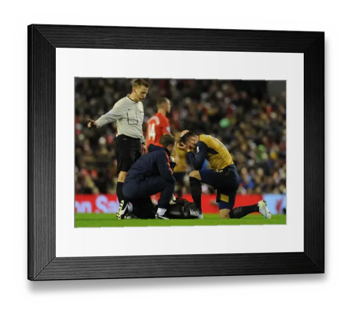 Framed Print : Arsenal's Olivier Giroud Receives Medical Attention on the Field during Liverpool vs Arsenal, Premier League 2015-16