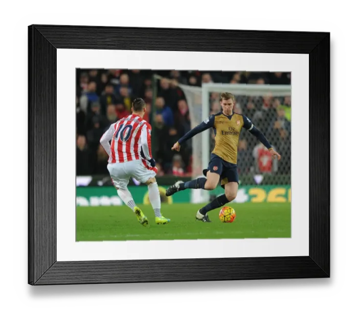 Framed Print : Per Mertesacker vs Marko Arnautovic: A Footballing Battle at Stoke City, Premier League 2015-16 Framed Print : Per Mertesacker vs Marko Arnautovic: A Footballing Battle at Stoke City, Premier League 2015-16