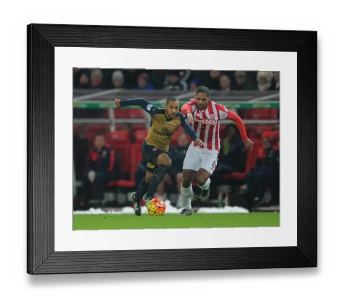 Framed Print : Theo Walcott vs. Glen Johnson: A Footballing Battle at Stoke City (Premier League 2015-16)