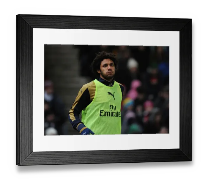 Framed Print : Arsenal's Ready Substitute: Mohamed Elneny Awaits His Premier League Debut against Stoke City Framed Print : Arsenal's Ready Substitute: Mohamed Elneny Awaits His Premier League Debut against Stoke City