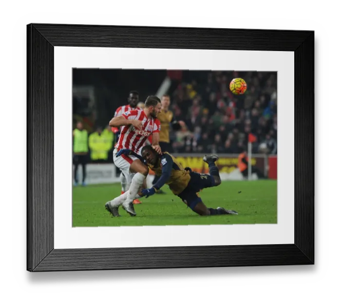 Framed Print : Intense Face-off: Joel Campbell vs. Erik Pieters in Arsenal's Premier League Battle
