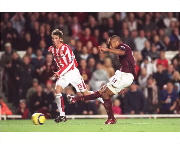 Thierry Henry scores Arsenals 3rd goal watched by Danny Collins (Sunderland)