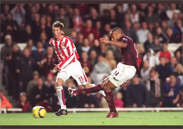 Thierry Henry scores Arsenals 3rd goal watched by Danny Collins (Sunderland)