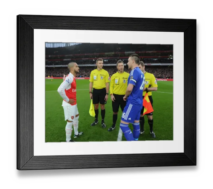 Framed Print : Premier League Rivalry: Arsenal vs. Chelsea - Walcott and Terry Lead the Charge at Emirates Stadium