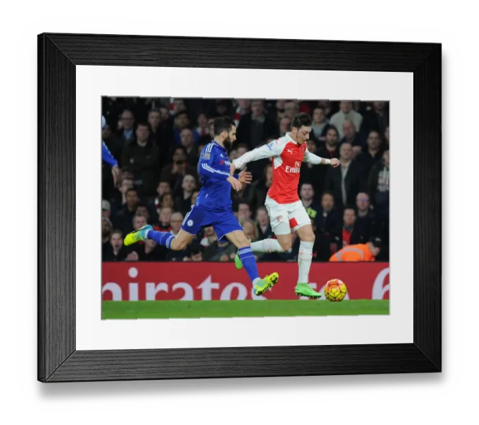 Framed Print : Clash of the Titans: Ozil vs. Fabregas - Arsenal vs. Chelsea Showdown