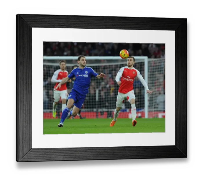 Framed Print : Ramsey vs Ivanovic: Chelsea's Narrow Victory Over Arsenal in Intense Premier League Clash