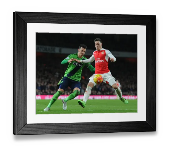 Framed Print : Mesut Ozil vs Jose Fonte: A Battle of Skills in the Arsenal vs Southampton Premier League Clash, 2015-16 Framed Print : Mesut Ozil vs Jose Fonte: A Battle of Skills in the Arsenal vs Southampton Premier League Clash, 2015-16