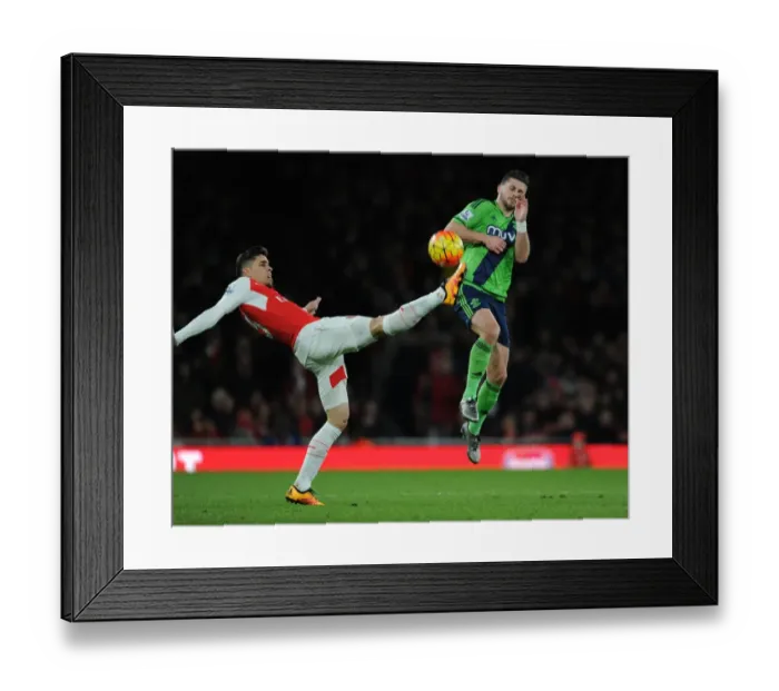 Framed Print : Gabriel vs. Long: A Premier League Showdown at Emirates Stadium
