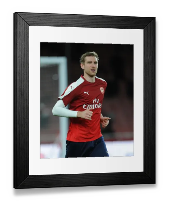 Framed Print : Per Mertesacker (Arsenal) warms up before the match Framed Print : Per Mertesacker (Arsenal) warms up before the match