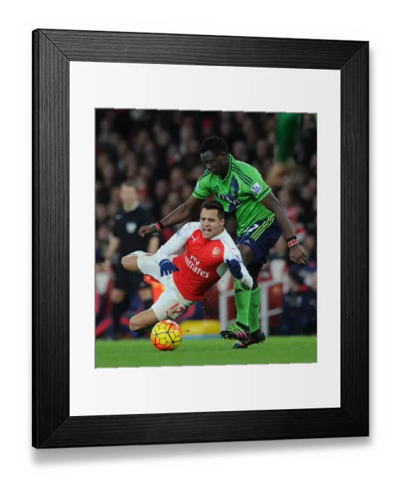 Framed Print : Arsenal's Alexis Sanchez Fouls by Southampton's Victor Wanyama in Premier League Clash Framed Print : Arsenal's Alexis Sanchez Fouls by Southampton's Victor Wanyama in Premier League Clash