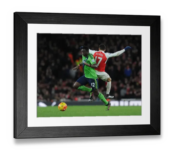 Framed Print : Arsenal's Alexis Sanchez Fouls by Southampton's Victor Wanyama in Intense Premier League Clash (2015-16) Framed Print : Arsenal's Alexis Sanchez Fouls by Southampton's Victor Wanyama in Intense Premier League Clash (2015-16)