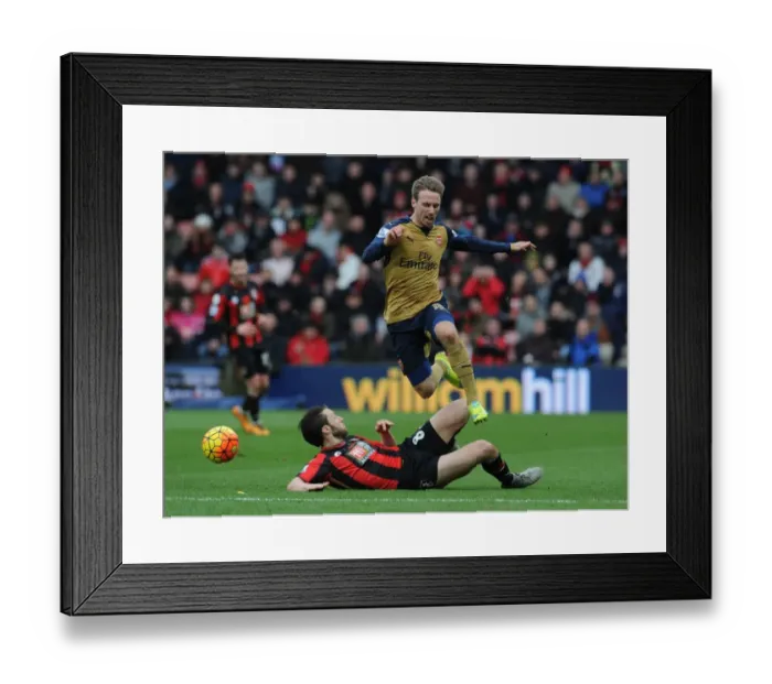 Framed Print : Intense Battle: Monreal vs. Arter at Bournemouth's The Vitality Stadium - Arsenal vs. Bournemouth, Premier League 2015-16