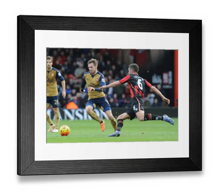 Framed Print : Ramsey's Powerful Surge: Arsenal's Midfield Maestro Outmaneuvers Surman in Bournemouth Clash, Premier League 2015-16 Framed Print : Ramsey's Powerful Surge: Arsenal's Midfield Maestro Outmaneuvers Surman in Bournemouth Clash, Premier League 2015-16