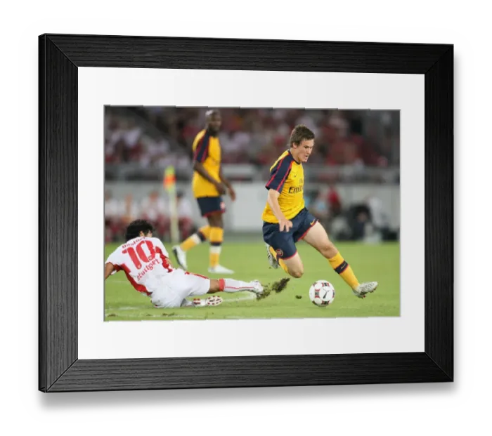 Framed Print : Aaron Ramsey (Arsenal) Basturk (Stuttgart) Framed Print : Aaron Ramsey (Arsenal) Basturk (Stuttgart)