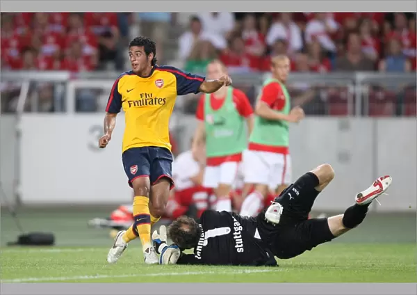 Carlos Vela (Arsenal) scores a goal past Jens Lehmann (Stuttgart)