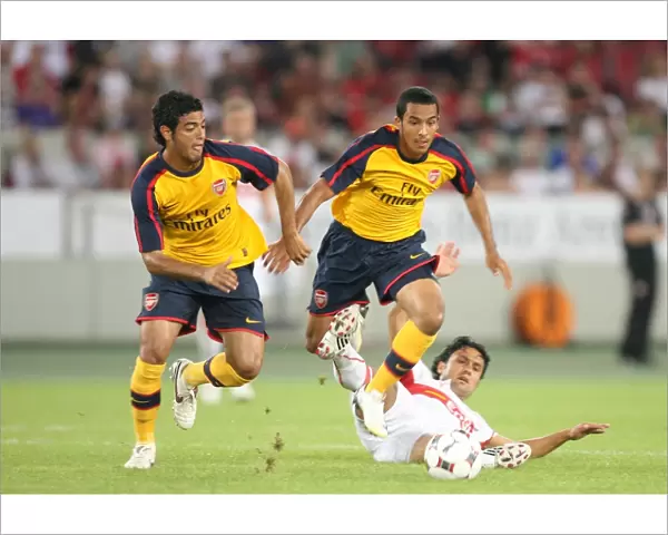 Theo Walcott and Carlos Vela (Arsenal) Tasci (Stuttgart)