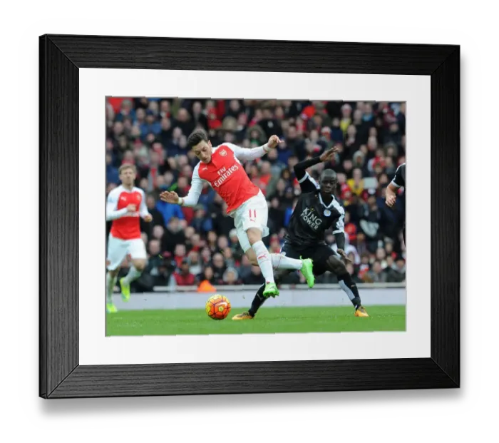 Framed Print : Mesut Ozil vs N'Golo Kante: A Premier League Showdown at Arsenal vs Leicester City
