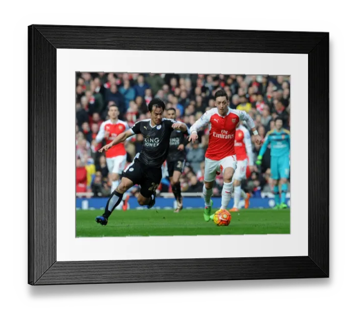 Framed Print : Mesut Ozil vs Shinji Okazaki: A Premier League Battle at the Emirates Framed Print : Mesut Ozil vs Shinji Okazaki: A Premier League Battle at the Emirates