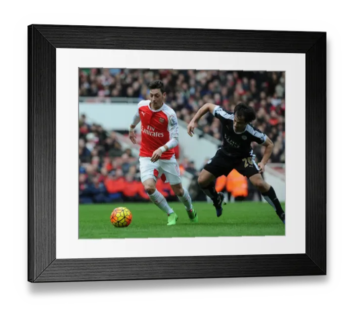 Framed Print : Mesut Ozil vs Shinji Okazaki: A Premier League Showdown at the Emirates Framed Print : Mesut Ozil vs Shinji Okazaki: A Premier League Showdown at the Emirates