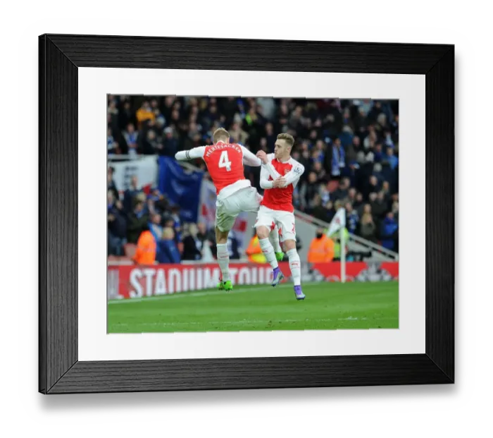 Framed Print : Arsenal's Glory: Mertesacker and Chambers Celebrate Premier League Victory over Leicester City