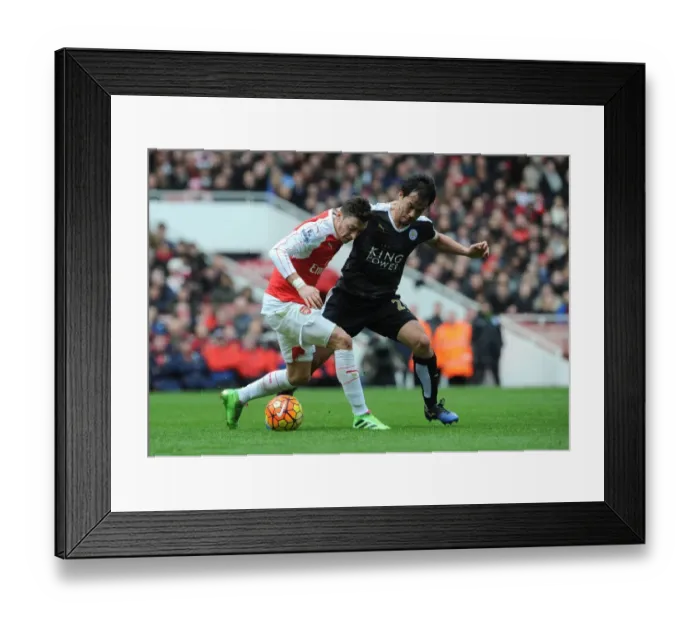 Framed Print : Mesut Ozil vs Shinji Okazaki: A Battle of Midfield Maestros at Emirates Stadium, Premier League 2015-16
