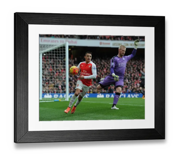 Framed Print : Arsenal's Alexis Sanchez Battles Kasper Schmeichel for Possession in Intense Arsenal vs Leicester City Clash Framed Print : Arsenal's Alexis Sanchez Battles Kasper Schmeichel for Possession in Intense Arsenal vs Leicester City Clash