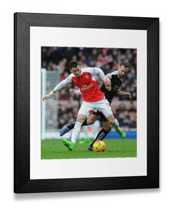 Framed Print : Mesut Ozil Outmaneuvers Christian Fuchs in Arsenal's Premier League Battle Against Leicester City (2015-16)