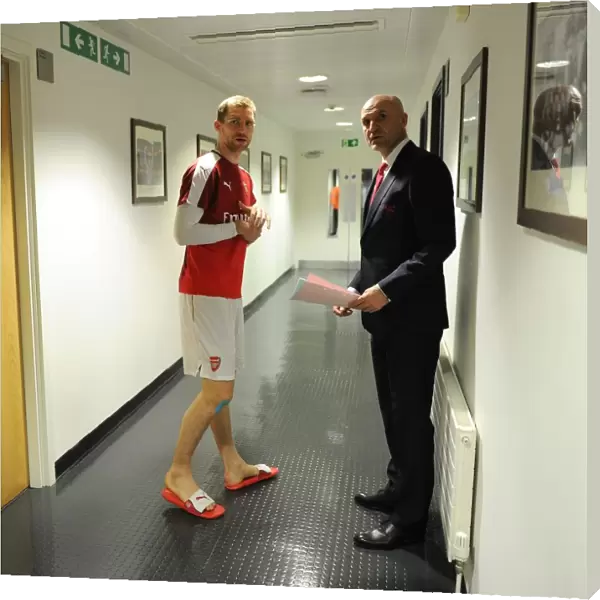Per Mertesacker (Arsenal) with Assistant Manager Steve Bould before the match. Arsenal 0