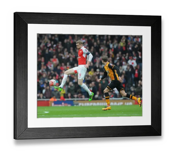 Framed Print : Per Mertesacker vs Nick Powell: A FA Cup Battle at Arsenal's Emirates Stadium Framed Print : Per Mertesacker vs Nick Powell: A FA Cup Battle at Arsenal's Emirates Stadium