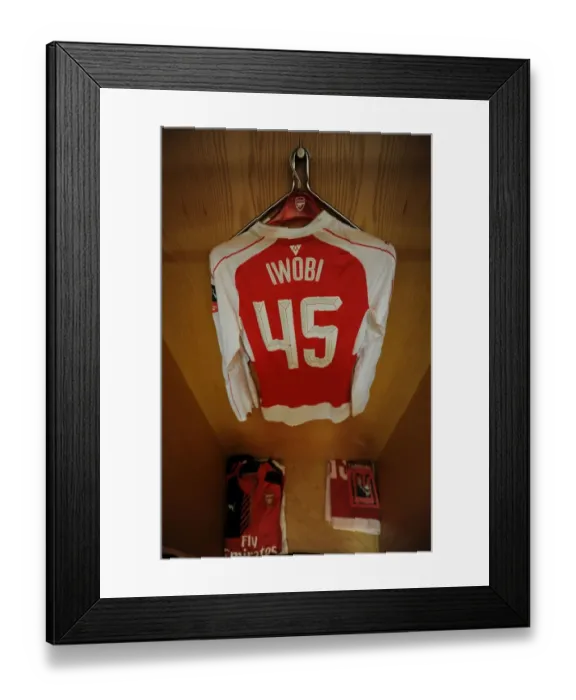 Framed Print : Arsenal FC: Alex Iwobi's Pre-Match Focus in the Home Changing Room (FA Cup: Arsenal vs Hull City) Framed Print : Arsenal FC: Alex Iwobi's Pre-Match Focus in the Home Changing Room (FA Cup: Arsenal vs Hull City)