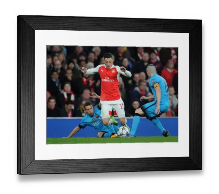 Framed Print : Arsenal vs. Barcelona: Ozil Tripped by Rakitic in Champions League Showdown