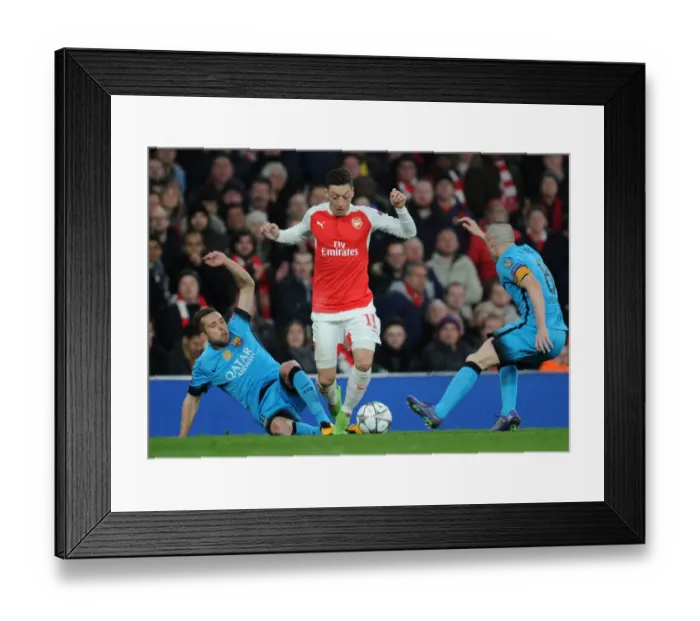 Framed Print : Arsenal vs. Barcelona: Ozil Tackled by Rakitic in Champions League Clash