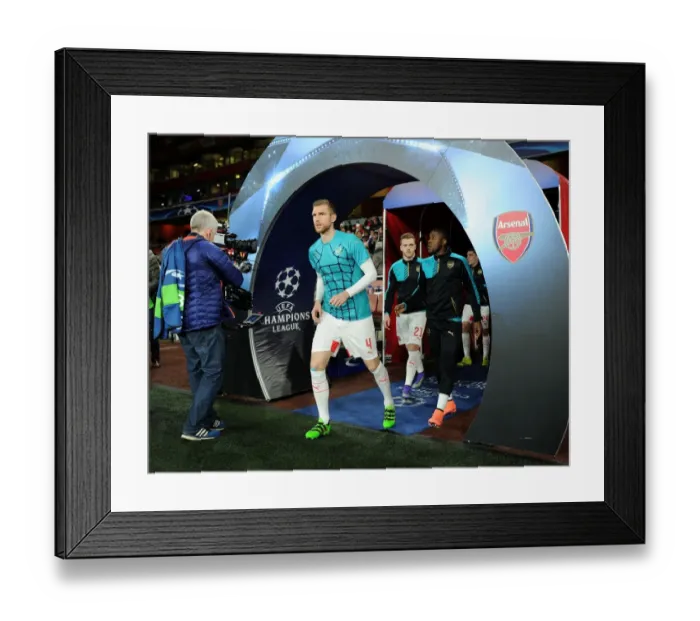 Framed Print : Arsenal FC vs. FC Barcelona: Per Mertesacker's Pre-Match Ritual - UEFA Champions League Round of 16, First Leg