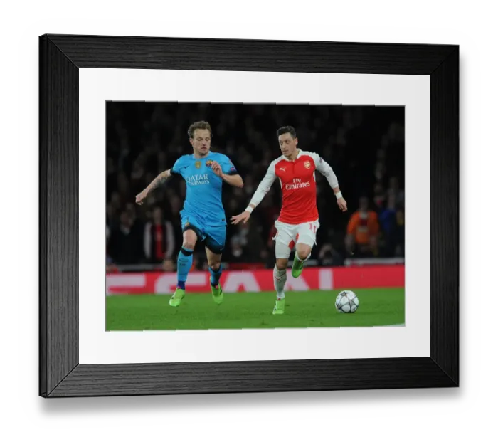 Framed Print : Mesut Ozil vs. Ivan Rakitic: Arsenal vs. Barcelona Clash in UEFA Champions League Framed Print : Mesut Ozil vs. Ivan Rakitic: Arsenal vs. Barcelona Clash in UEFA Champions League