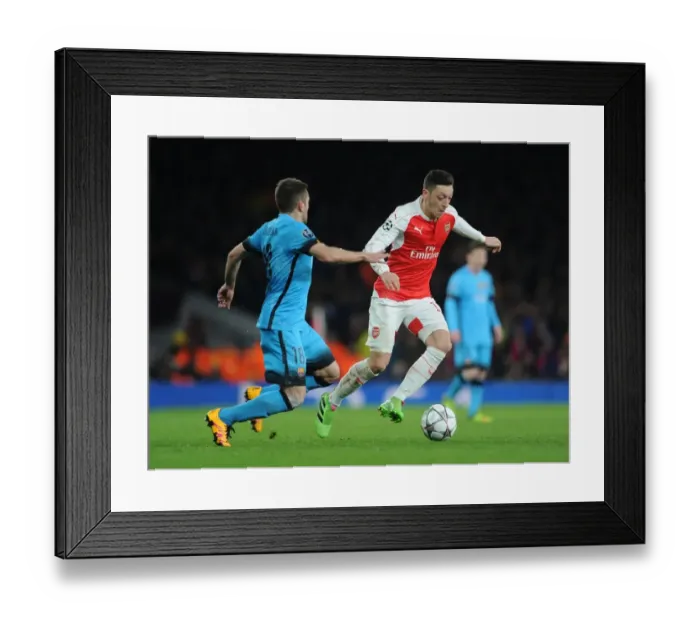 Framed Print : Mesut Ozil vs. Jordi Alba: A Champions League Showdown at the Emirates Framed Print : Mesut Ozil vs. Jordi Alba: A Champions League Showdown at the Emirates