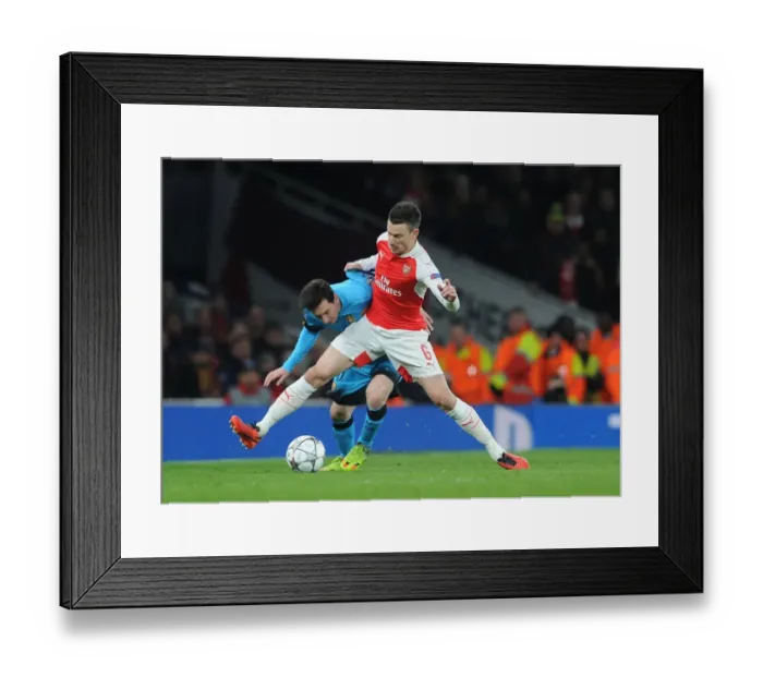 Framed Print : Koscielny vs. Messi: A Champions League Battle at Arsenal